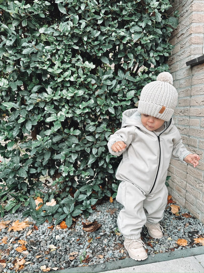 Regenoverall aus Sand